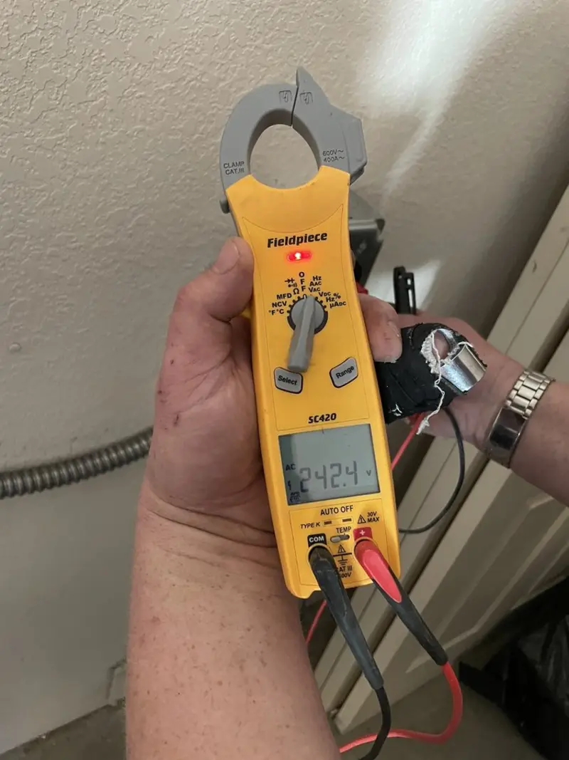 Voltage testing with clamp meter during Electrical Installation Services in Lady Lake